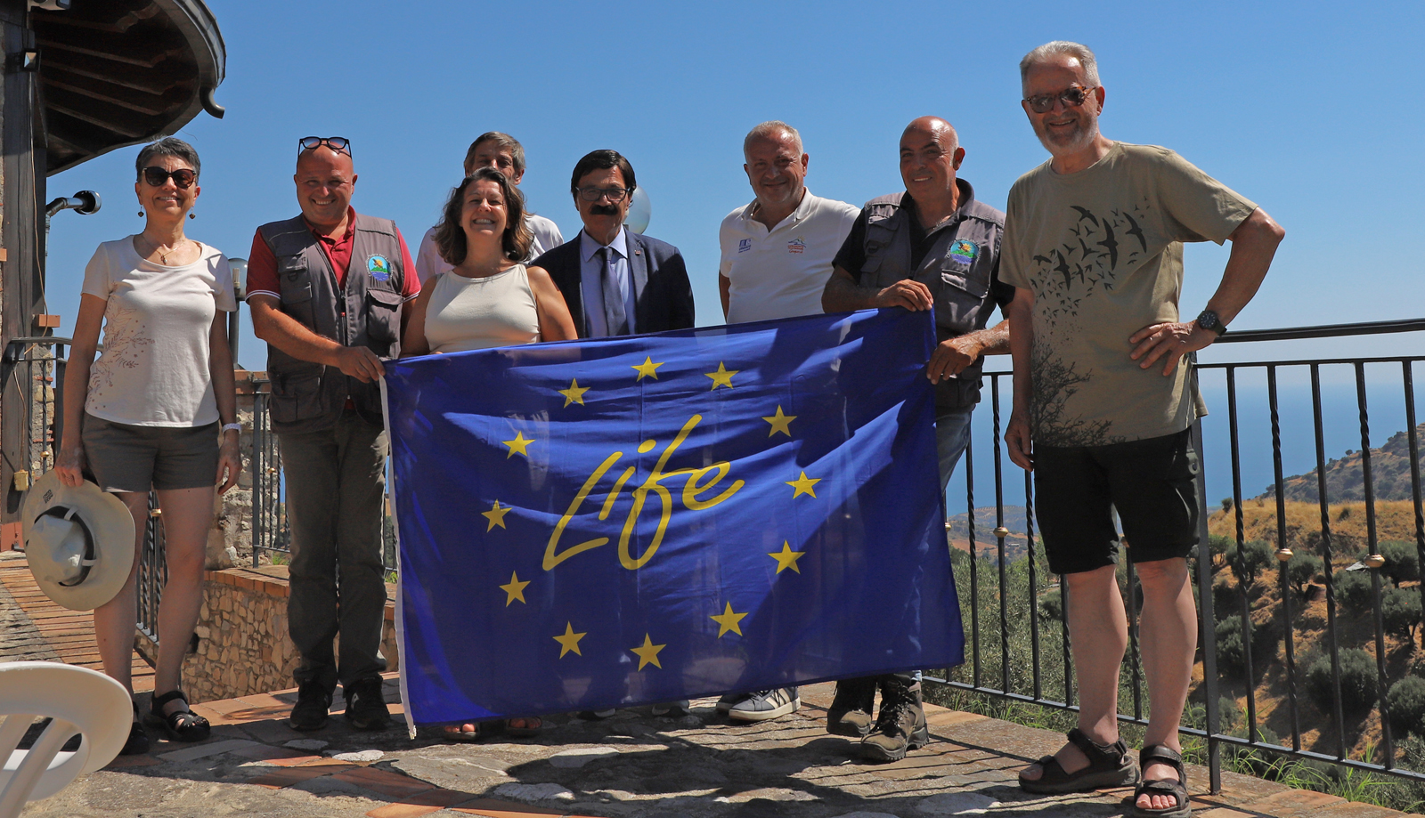 Project team, advisers, and monitors with the mayor of Bova